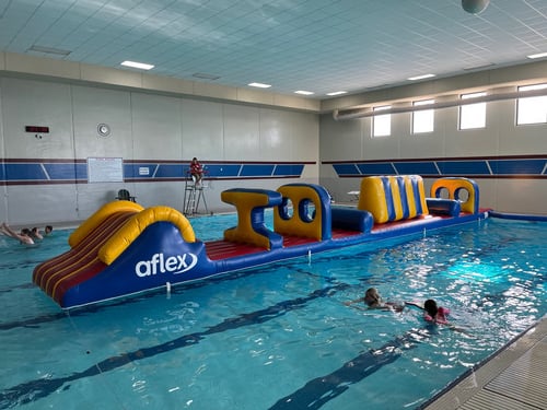 Pool with obstacle course inflated.