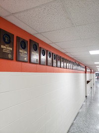 photo of hallway with plaques displayed.